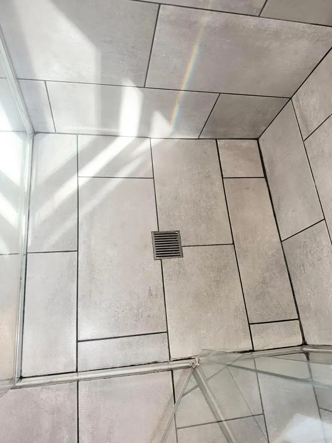 Shower tiles after a FirstChoice cleaning job